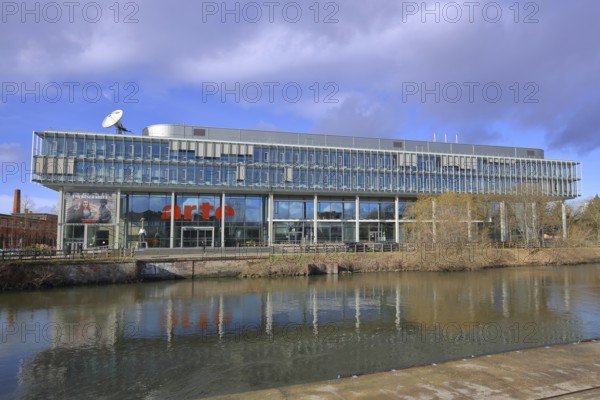 Modern building of the broadcasting station Arte of ARD and ZDF at the river Ill, bank, satellite dish, parabolic antenna, antenna dish, TV station, broadcasting, Strasbourg, Bas-Rhin, Alsace, France, Europe