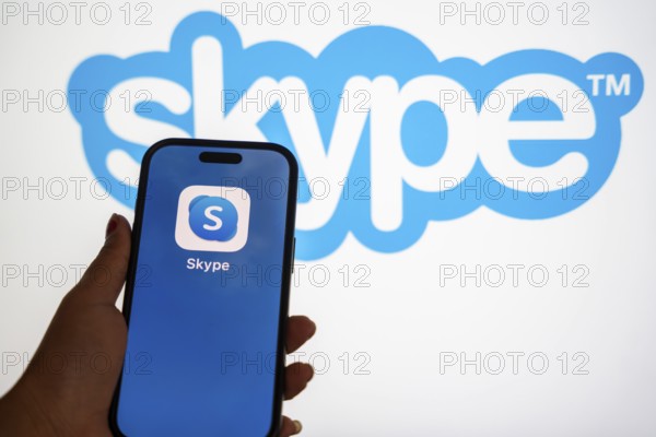 In this photo illustration, a person holds a mobile phone displaying Skype application, in Guwahati, India on 3 March 2025. Skype is shutting down in May 2025, and Microsoft is moving users to Teams