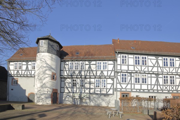 Small castle built in 1564, historic half-timbered house with oriel and turret, Rückingen, Erlensee, Hesse, Germany, Europe