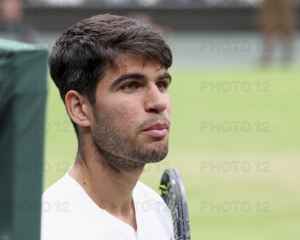 Spanish tennis player Carlos Alcaraz looking at his coach on the centre court at the 2024 Wimbledon Championships, London, England, United Kingdom, Europe