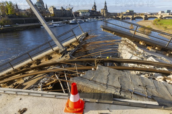 Partial collapse of the Carola Bridge. Over a length of around 100 metres, the section on which the trams normally run has collapsed into the Elbe. The demolition of the section is in full swing. Dresden, Saxony, Germany, Europe