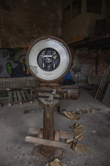 Old abandoned paper factory. Historic and typical factory building as a lost place. Destruction and decay are damaging the substance. Original machines and objects can be found here in Sweden