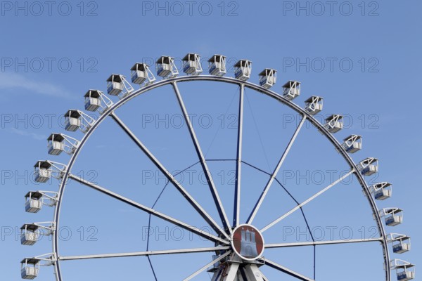 Ferris wheel with Hamburg city coat of arms against a blue sky in summer on Hamburg Cathedral, Heiligengeistfeld, Hamburg, Germany, Europe