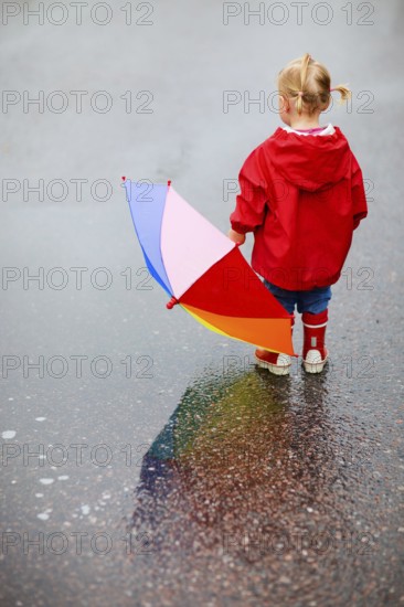 A little girl with an umbrella, Finland, Scandinavia, Europe