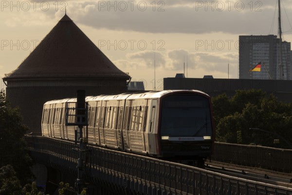 Underground, Hamburger Verkehrsverbund HVV, local transport, railway line in the evening light with moving train of the underground line U3 on the viaduct at the Baumwall stop, Hamburg, Germany, Europe