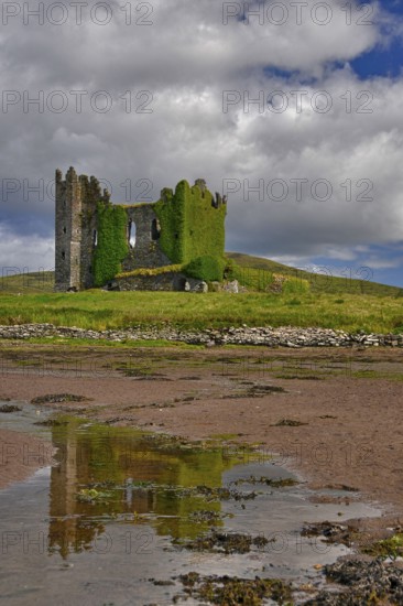Castle ruin, mudflats, low tide