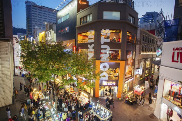 Seoul, South Korea, October 23, 2014: Myeong-dong is a vibrant shopping and tourism district in Jong-gu, central Seoul South Korea, Asia