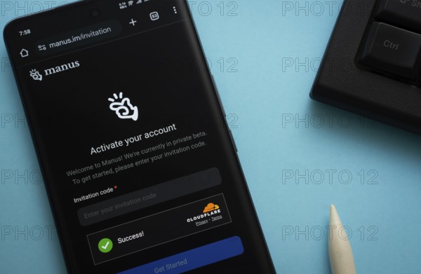 Homepage of Manus AI is seen on a smartphone
