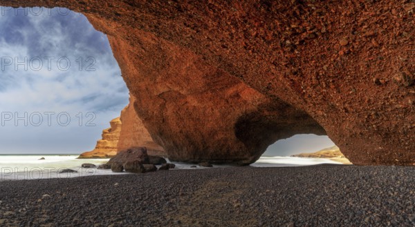 A view of the beach and rock arch at Legzira on the Atlantic Coast of Morocco