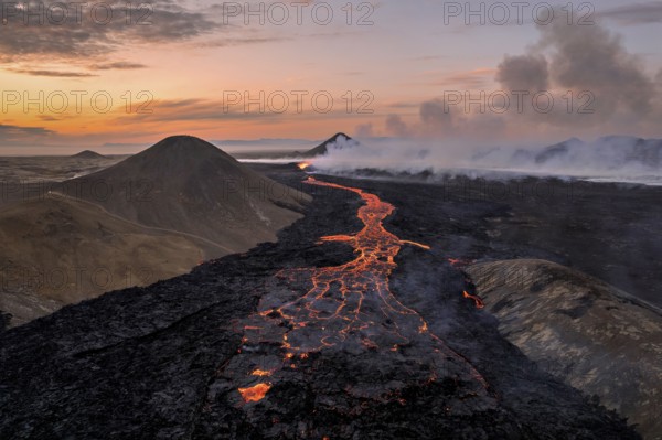 Drone image of a volcanic eruption in the evening light in Grindavik, Sudurnes, Iceland, Europe