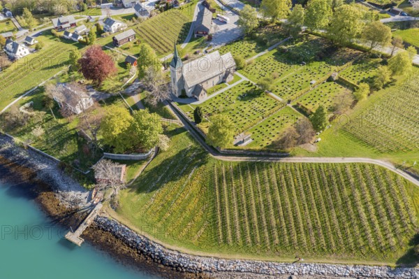 Aerial view of church and apple orchards, Ullensvang near Lofthus, Hardangerfjord, Norway, Europe