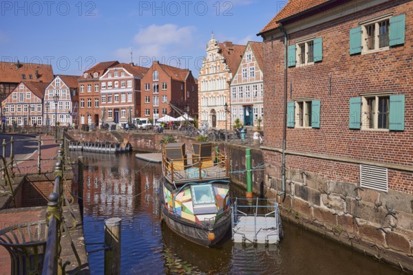 Harbour basin with railings, boats and the gabled houses, brick buildings and half-timbered houses along the Water West in the Old Hanseatic Harbour of Stade, Hanseatic city, district of Stade, Lower Saxony, Germany, Europe