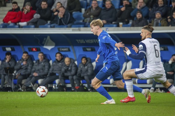 Football UEFA Europa League, 2024/25 season, matchday 7: TSG Hoffenheim v Tottenham Hotspur. Picture: Duel between Max Moerstedt (33, Hoffenheim) and Radu Dragusin (6, Tottenham)