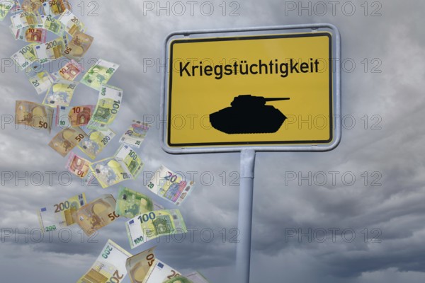 (Photomontage) Town entrance sign with a tank and the inscription KRIEGSTÜCHTIGKEIT against a gloomy sky on which euro banknotes are raining down