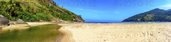 Panoramic image of tropical Bonete beach in Ilhabela with the river flowing into the sea, Bonete beach, Ilhabela, Sao Paulo, Brazil, South America