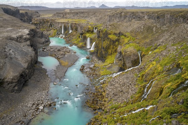 Waterfalls and a turquoise blue river flowing through a canyon, Sigöldugljúfur, long exposure, Icelandic highlands, Iceland, Europe