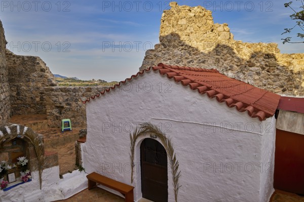 Small chapel with red tiled roof amidst ancient ruins and landscape, Archangelos, castle, place, Castle of Archangelos, Rhodes, Dodecanese, Greek Islands, Greece, Europe