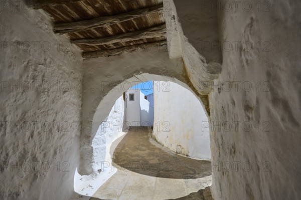 Arched passageway with wooden ceiling and white walls in a historic building, Chora, main town of Patmos, Patmos, Old Town, Dodecanese, Greek Islands, Greece, Europe