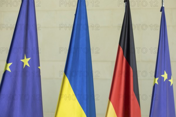 Flags of the European Union (EU), Ukraine and the Federal Republic of Germany in front of the joint press statement by Volodymyr Zelensky (President of Ukraine) and Olaf Scholz (Chancellor of the Federal Republic of Germany) at the Federal Chancellery, 11 October 2024