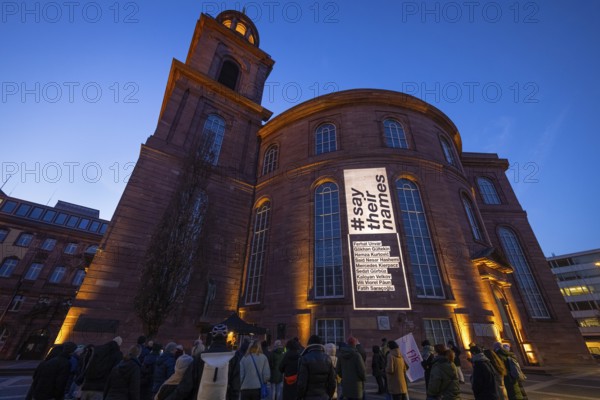 A memorial service is held in front of St Paul's Church in Frankfurt am Main for the victims of the racially motivated attack in Hanau on 19 February 2020. Nine people were killed at the time. The names of the victims can be read on the façade of St Paul's Church under the hashtag saytheirnames, St Paul's Church, Frankfurt am Main, Hesse, Germany, Europe
