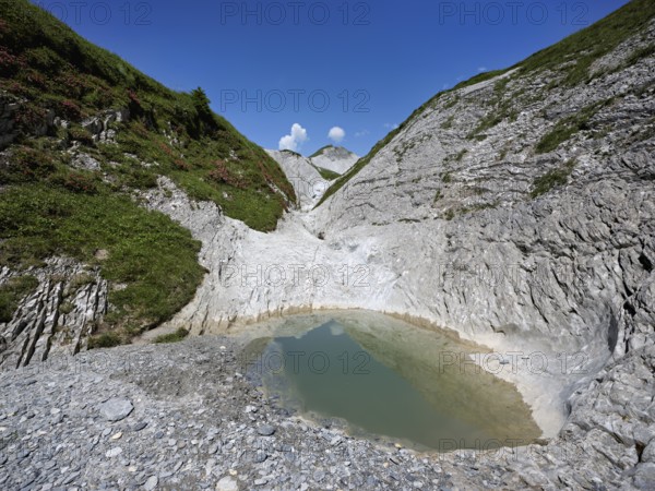 Glacier mill with glacier pots on the Trinser Alp Mora, Trin, Canton Graubünden, Switzerland, Europe