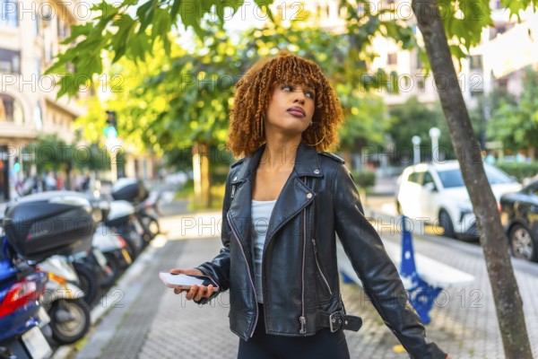 Side view of a beauty millennial latin woman listening to music walking along a city