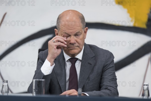 Olaf Scholz (Chancellor of the Federal Republic of Germany, SPD) shows signs of fatigue at the press conference after 10 p.m. following the Minister-Presidents' Conference with the heads of government of the federal states in the Federal Chancellery, Berlin, 20 June 2024