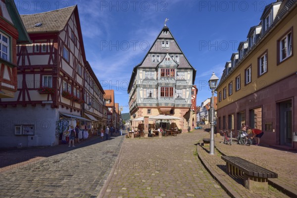 Inn and Hotel Zum Riesen with lantern and benches against blue sky with cirrostratus clouds in Miltenberg, Lower Franconia, Miltenberg district, Bavaria, Germany, Europe