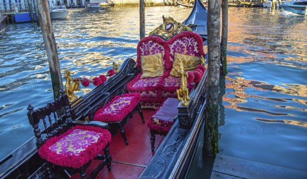 Luxury Gondola waiting for tourists near famous Rialto Bridge in Venice
