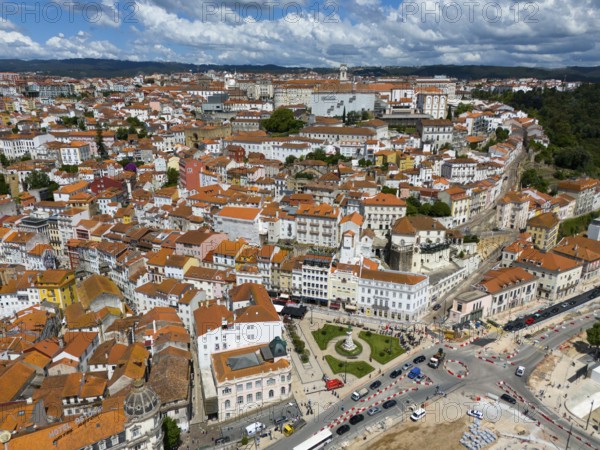 City view with red tiled roofs, densely built-up buildings and a blue sky with clouds, aerial view, Coimbra, Rio Mondego, Portugal, Europe