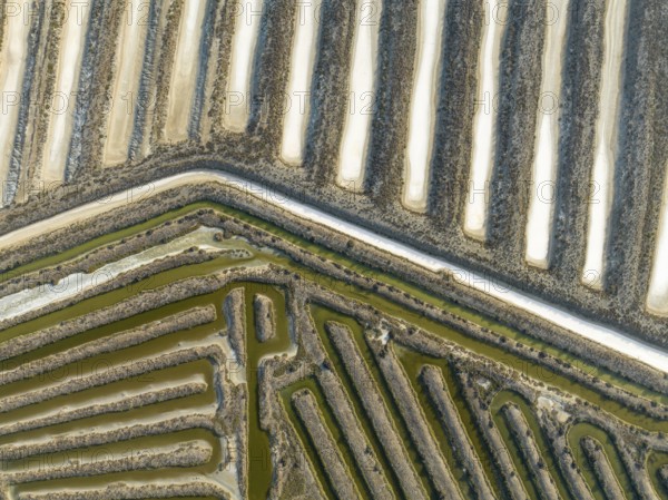 Saline ponds at the salt works near Chiclana de la Frontera. Aerial view. Drone shot. Cádiz province, Andalusia, Spain, Europe