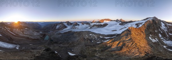 Atmospheric sunrise in a picturesque mountain landscape, alpenglow, aerial view, mountain hut Becherhaus at the summit Becher and glacier Übeltalferner, Stubai Alps, South Tyrol, Italy, Europe