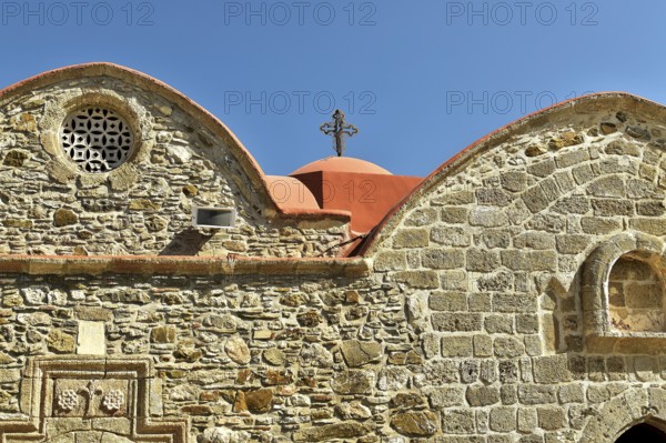 Historic church with detailed stone façade and red roof, Asklipio village, Asklipion, Kimisis tis Theotokou church, Rhodes, Dodecanese, Greek Islands, Greece, Europe