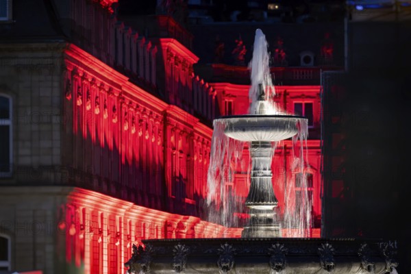 Court of honour on Schlossplatz. The New Palace and fountain are illuminated. Stuttgart, Baden-Württemberg, Germany, Europe