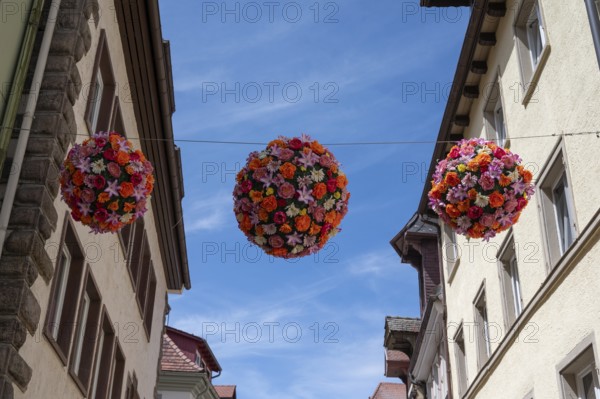 Colourful flower balls decorate the streets of Villingen-Schwenningen, Baden-Württemberg, Germany, Europe