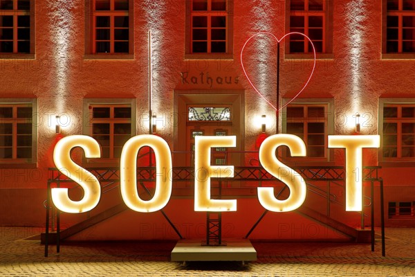 Illuminated town hall with Soest lettering in the evening at the Winterstrahlen Festival of Lights in Soest, North Rhine-Westphalia, Germany, Europe