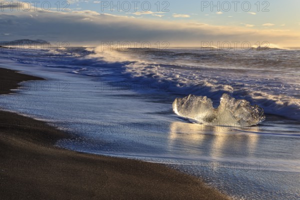 Ice floes on the beach, waves, sunny, morning mood, winter, Diamond Beach, Breidamerkursandur, Jökulsarlon, Iceland, Europe