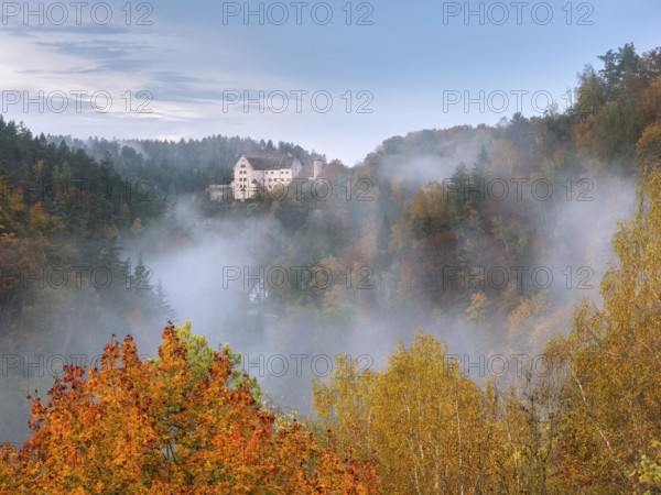 View of Rabenstein Castle in autumn, morning fog in Ahorntal, Waischenfeld, Upper Franconia, Franconian Switzerland, Bavaria, Germany, Europe