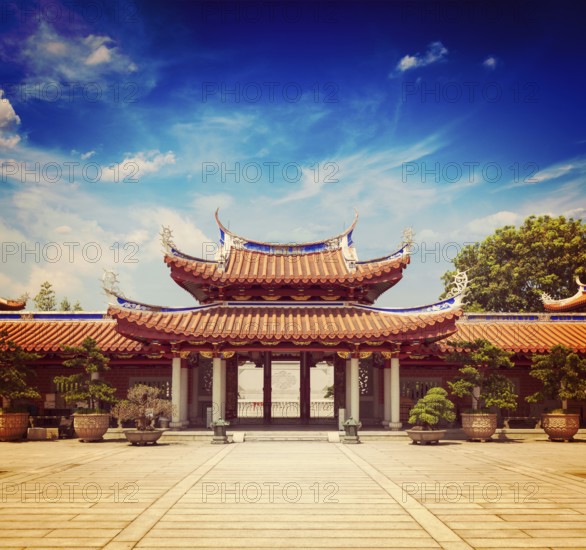Vintage retro effect filtered hipster style travel image of gates of Lian Shan Shuang Lin Monastery, Singapore, Asia