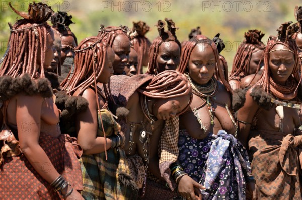 Mourning Himba women at a funeral, the widow in the middle, Omohanja, Kaokoland, Kunene, Namibia, Africa