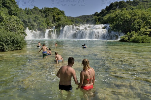 Tourists taking a bath at the Skradinski buk waterfalls, Krka National Park, Šibenik-Knin County, Dalmatia, Croatia, Europe
