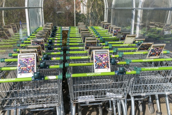 Waitrose supermarket shopping trolleys, Saxmundham, Suffolk, England, UK
