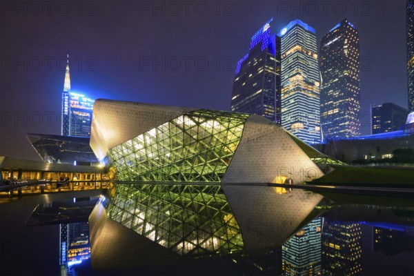 GUANGZHOU, CHINA, APRIL 27, 2018: Guangzhou Opera House designed by famous Iraqi architect architect Zaha Hadid illluminated at night