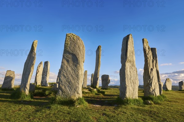 Calanais Standing Stones central stone circle erected between 2900-2600BC measuring 11 metres wide. At the centre of the ring stands a huge monolith stone 4. 8 metres high weighing about 7 tonnes, which is perfectly orientated so that its widest sides