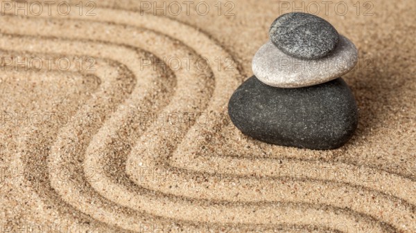 Japanese Zen stone garden, relaxation, meditation, simplicity and balance concept, panorama of pebbles and raked sand tranquil calm scene