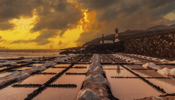 Sunset at the Fuencaliente Lighthouse next to the salt flats, on the route of the volcanoes south of the island of La Palma, Canary Islands, Spain, Europe