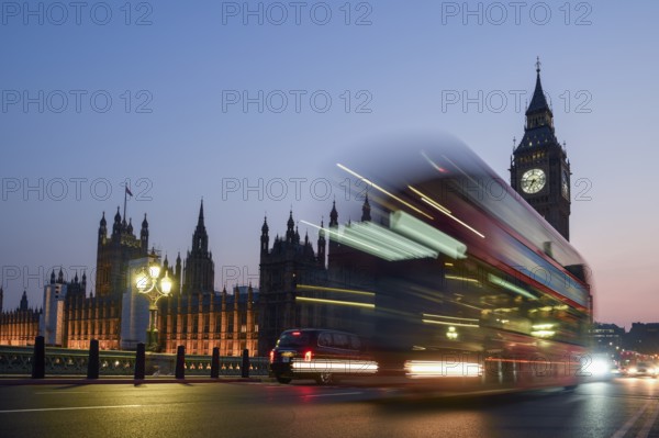 Red double-decker bus on Westminster Bridge, blue hour, Big Ben in the background, Westminster, London, England, United Kingdom, Europe