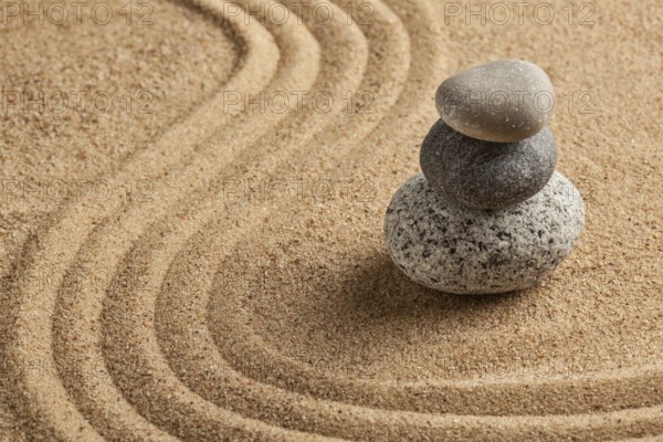 Japanese Zen stone garden, relaxation, meditation, simplicity and balance concept, pebbles and raked sand tranquil calm scene