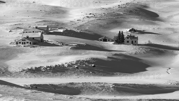 Farmhouse in snow-covered hilly landscape, near Akureyri, black and white photo, Northern Iceland Eyestra, Iceland, Europe