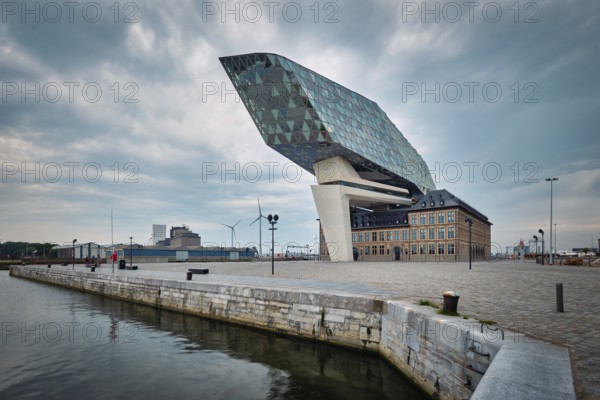 ANTWERP, BELGIUM, MAY 27, 2018: Antwerp port administration headquarters, designed by famous iranian architect Zaha Hadid, Antwerpen, Belgium which was her last project in stormy weather